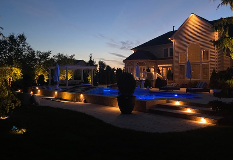 nice house, pool and outdoorm lighting at night