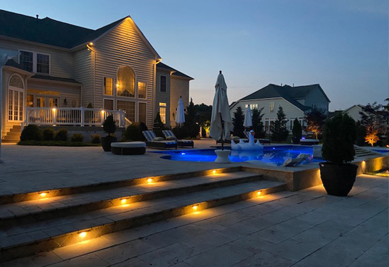 nice house, pool and outdor lighting at night